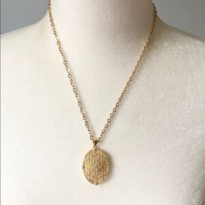 Gold and rhinestone oval pendant necklace
